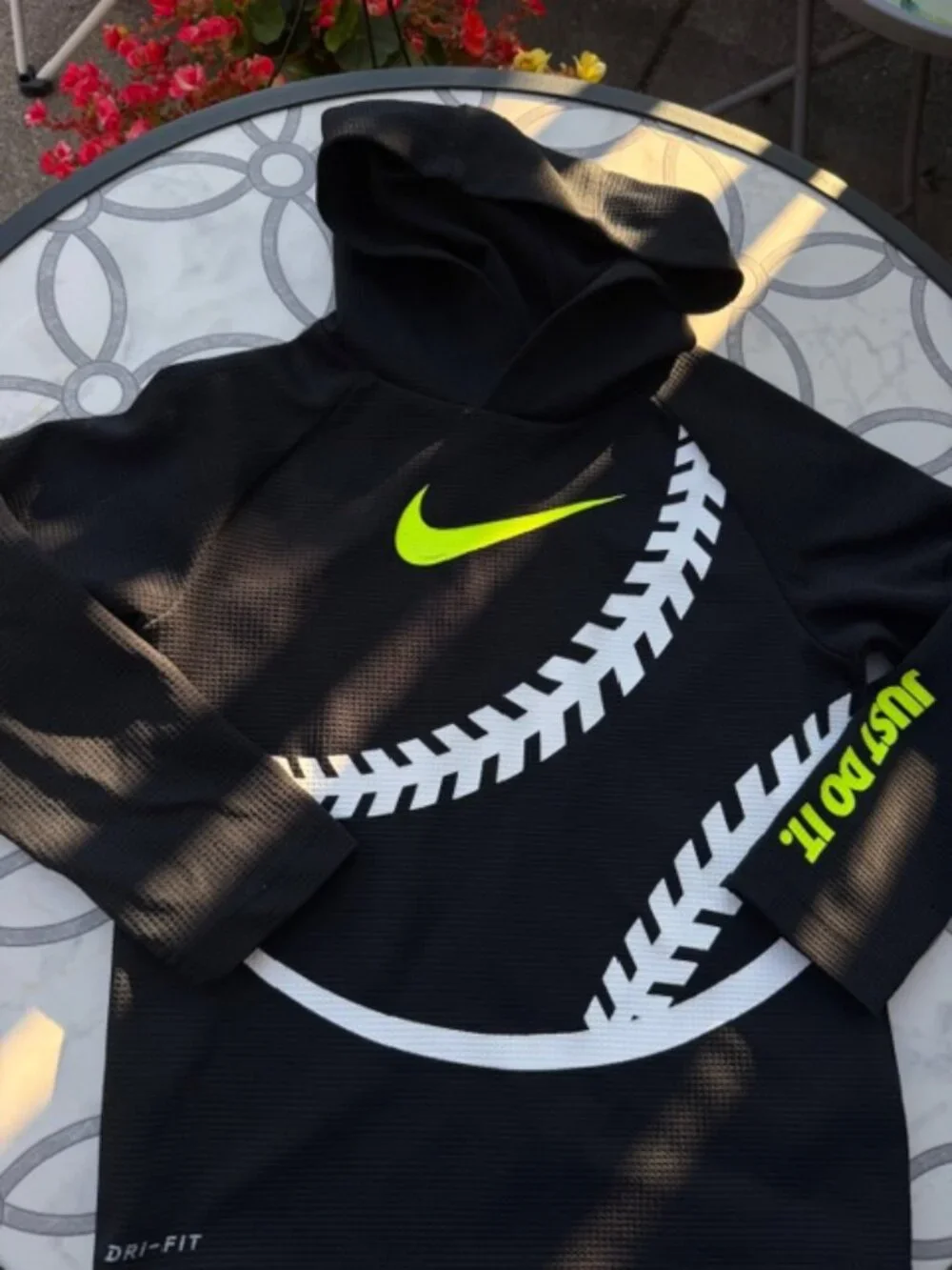 Nike Dri-FIT hoodie featuring a neon yellow swoosh logo and baseball stitching