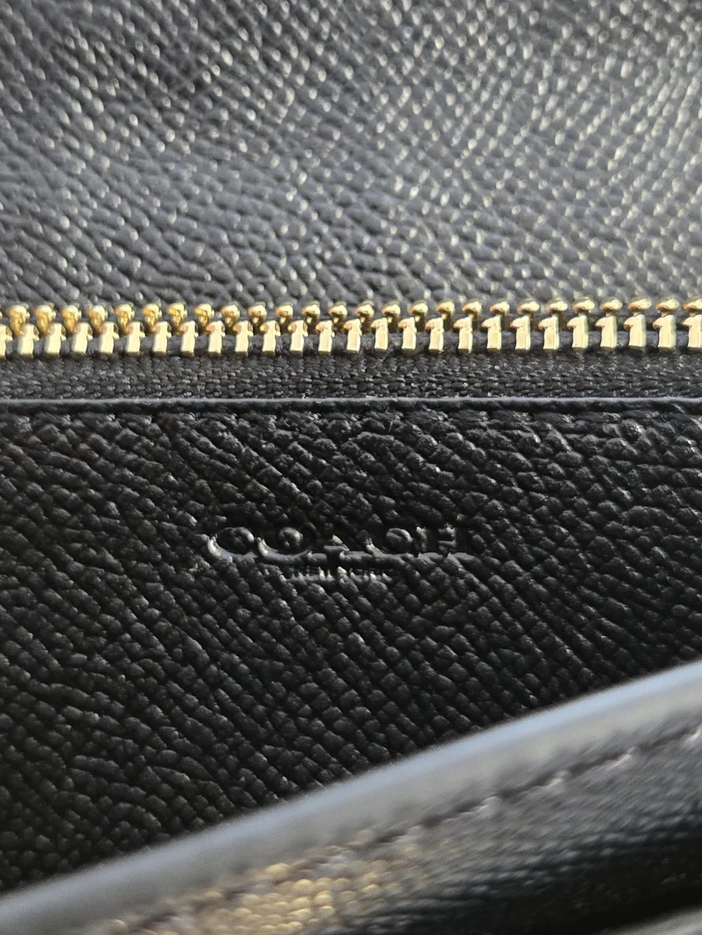 Coach sleek black